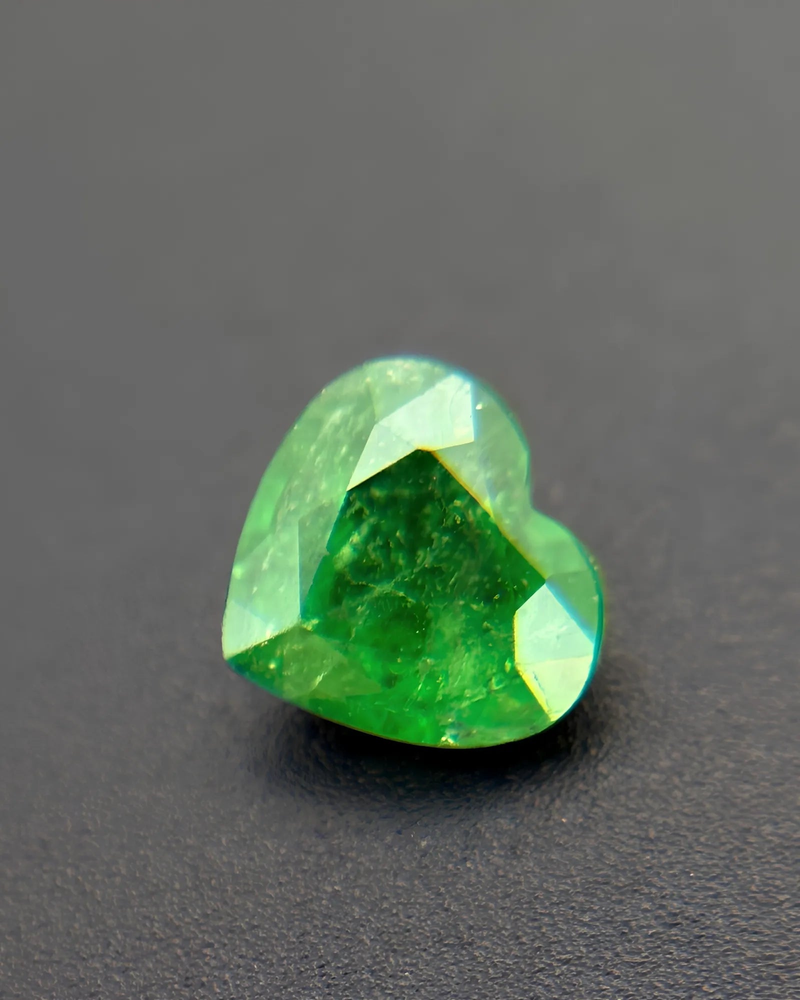 Green Natural Tsavorite Garnet heart-cut loose gemstone close-up | SARATTI