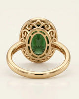 Green tourmaline engagement ring with diamond halo in 18K yellow gold | SARATTI