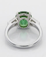 Green tourmaline engagement ring with emerald-cut diamond accents in 18K white gold | SARATTI