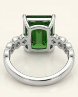 Green tourmaline ring with six diamond accents and architectural shoulder details in platinum | SARATTI
