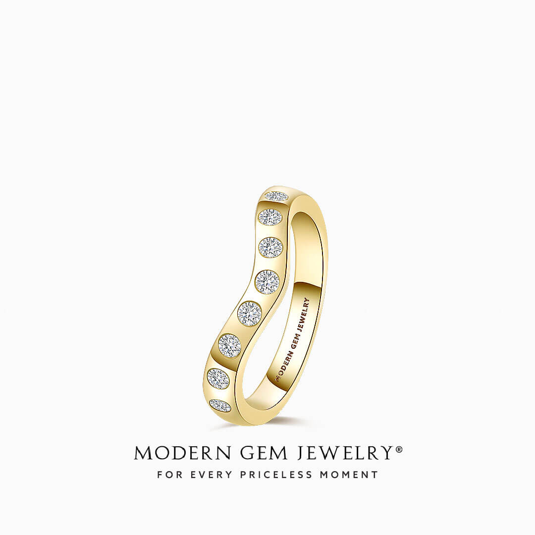 Elegant Yellow Gold Wedding Band With Bezel Set Diamonds against White Background | Modern Gem Jewelry | Saratti 