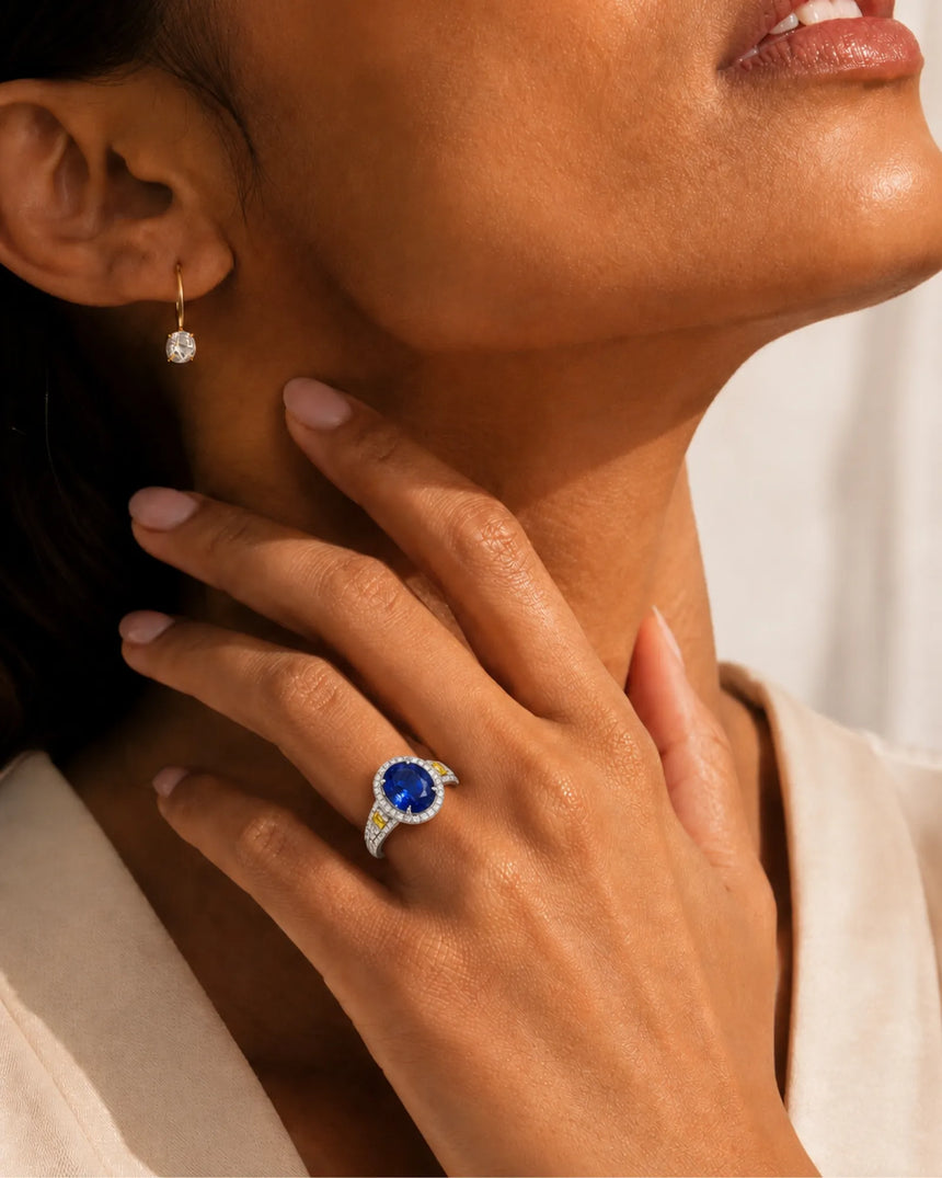 Halo sapphire ring with split shank diamonds and fancy yellow accents in 18K white gold | SARATTI