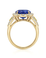 Halo sapphire ring with split shank diamonds and fancy yellow accents in 18K yellow gold | SARATTI