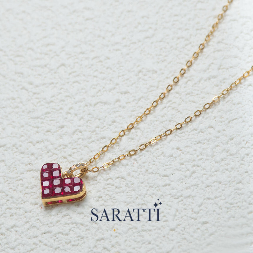 The Yellow Gold Alma Rosa Ruby Heart Necklace against white backdrop | Saratti Fine Jewelry 