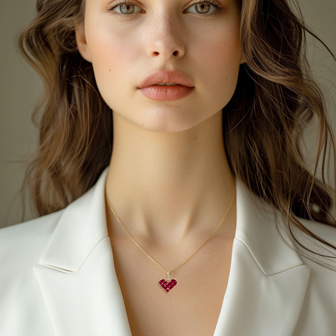 Model wears the dainty Alma Rosa Ruby Heart Necklace | Saratti Fine Jewelry 