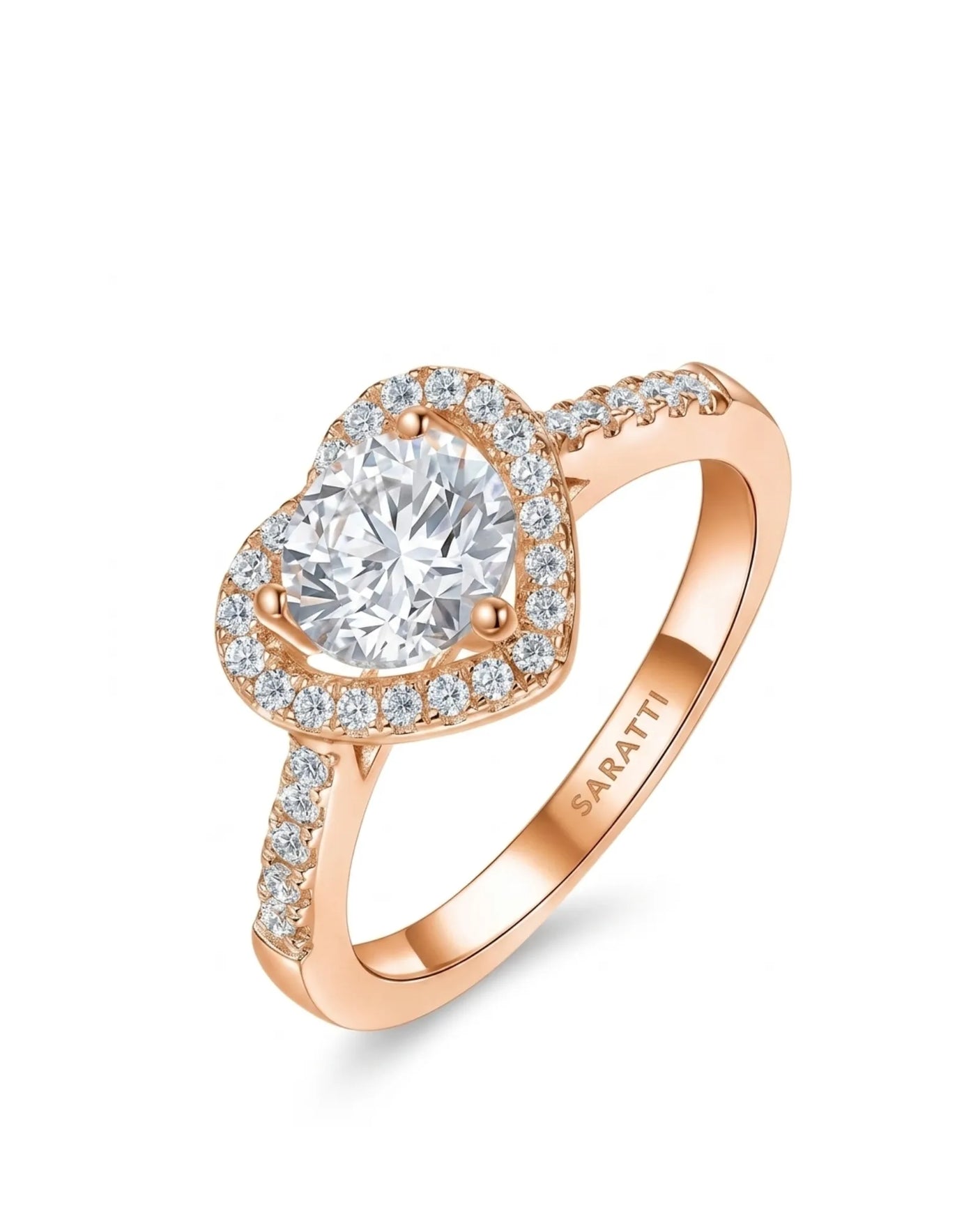 Heart-shaped moissanite engagement ring with halo accents and pavé shoulders in 18K rose gold | SARATTI