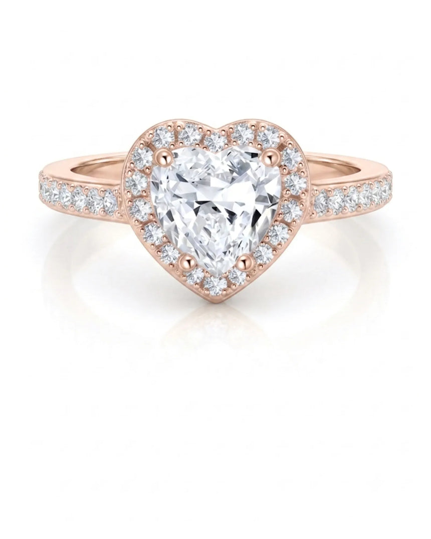 Heart moissanite center stone ring with soft rose gold and halo sparkle | SARATTI