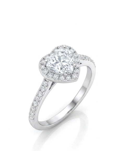 Heart shaped moissanite engagement ring with halo and pavé band in white gold | SARATTI