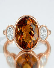 Imperial Topaz Three-Stone Bezel Setting in rose gold | SARATTI