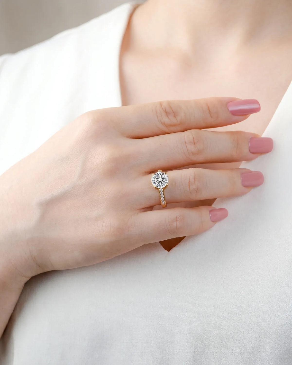 Layla engagement ring side profile with elevated prong setting and diamond shoulders in 18K yellow gold | SARATTI
