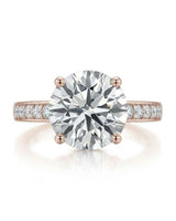 Layla round engagement ring worn on hand with diamond-set band in 18K rose gold | SARATTI