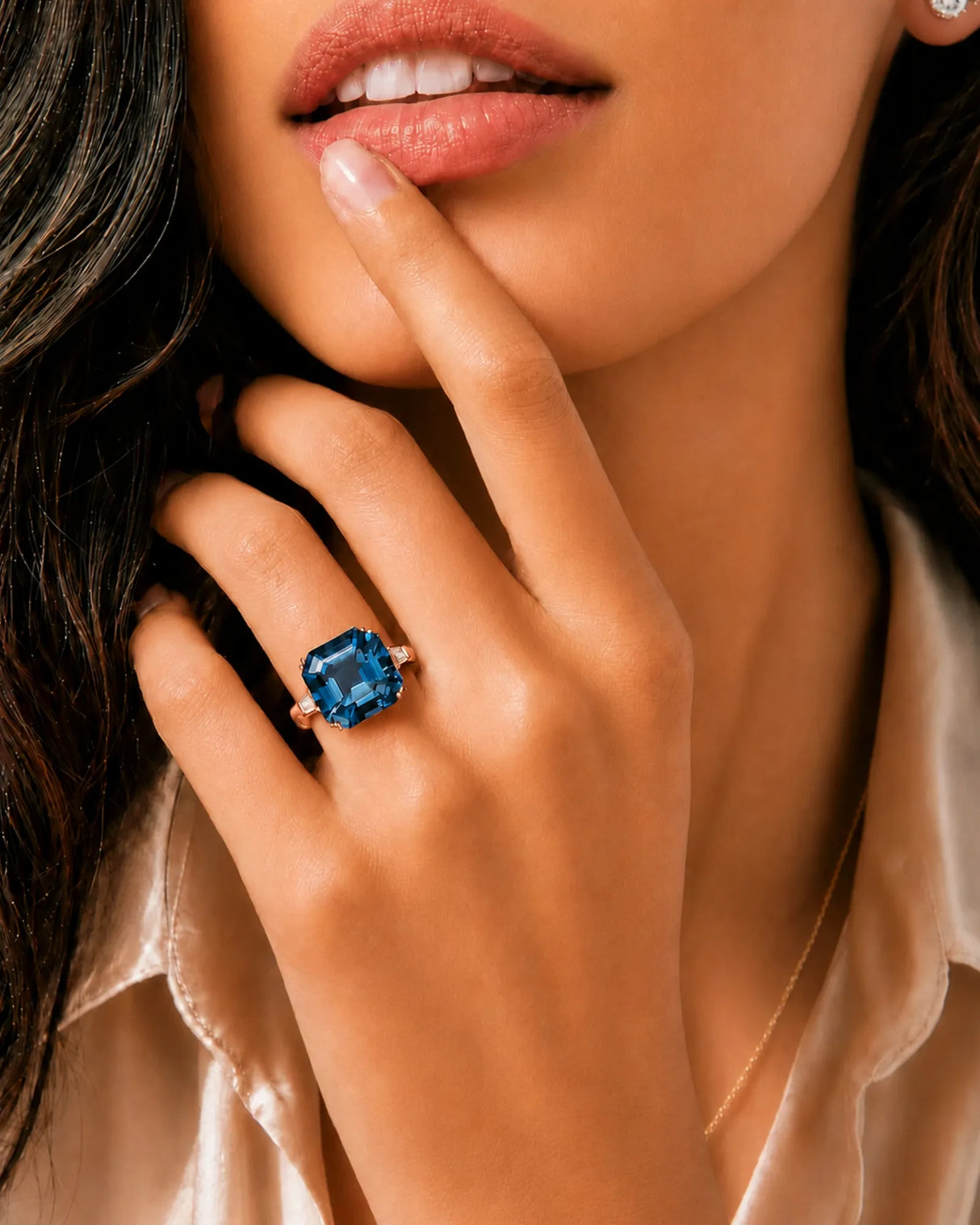 London Blue topaz engagement ring with tapered baguette diamonds and romantic 18K rose gold warmth | SARATTI