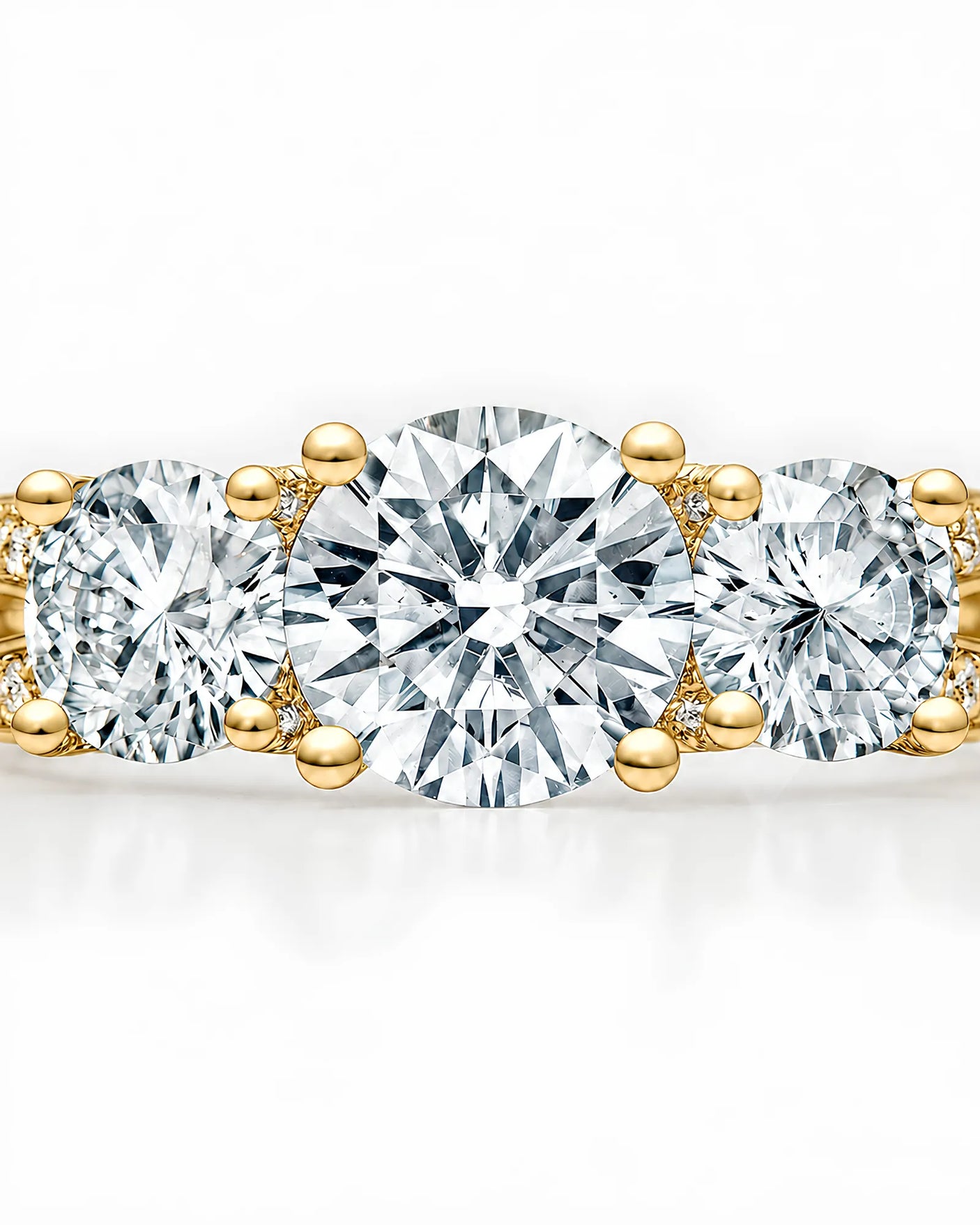 Luxury 18K yellow gold moissanite ring with open baskets and brilliant pavé detailing | SARATTI