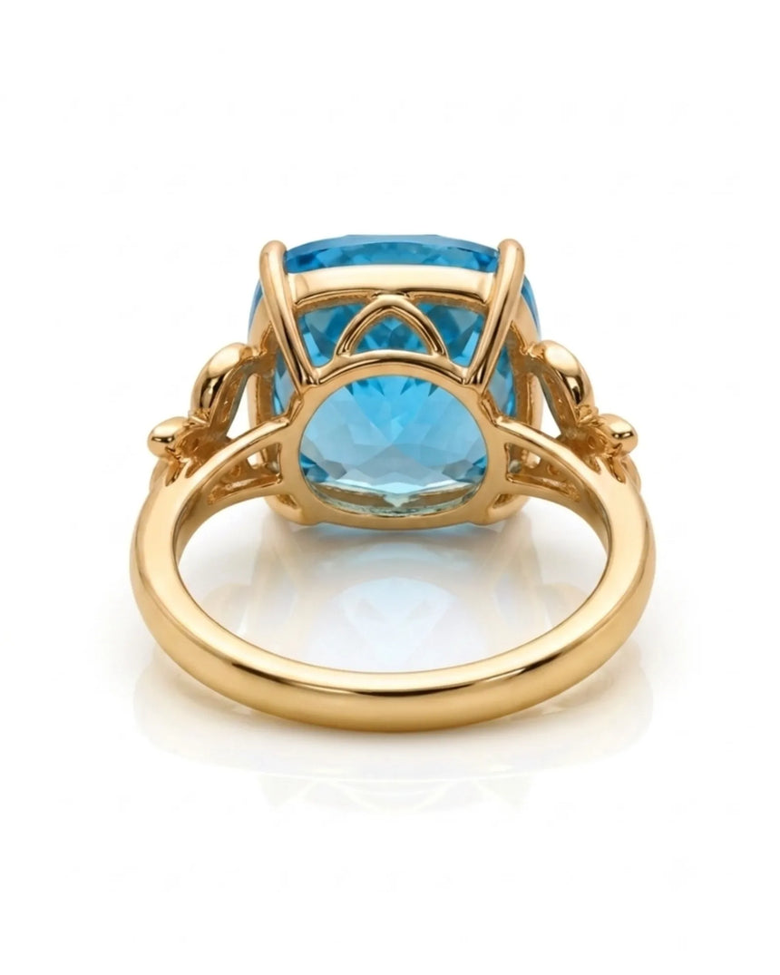 Luxury Swiss Blue topaz statement ring with sculpted diamond shoulders in 18K yellow gold - SARATTI