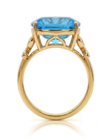Luxury Swiss Blue topaz statement ring with sculpted diamond shoulders in 18K yellow gold | SARATTI