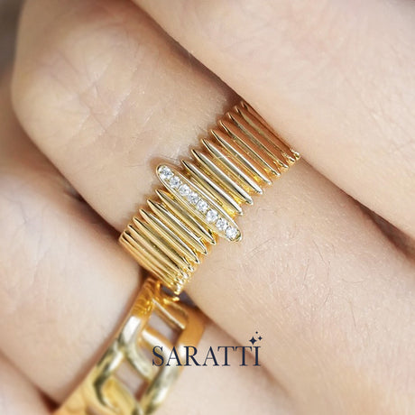 Luxury architectural gold ring featuring a pavé diamond bar and sculpted ribbed design | SARATTI