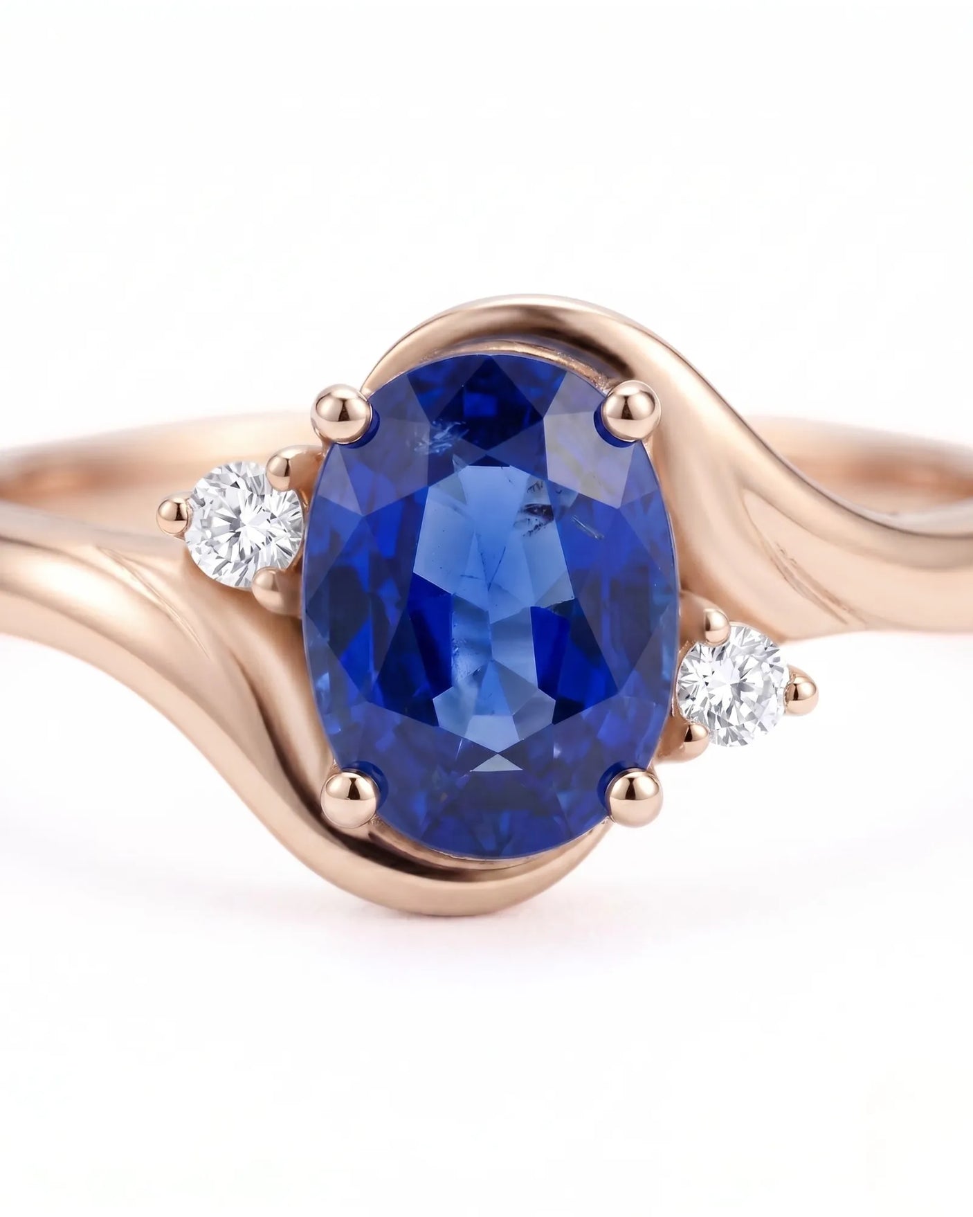 Luxury blue sapphire diamond ring with soft rose gold curves in 18K rose gold | SARATTI