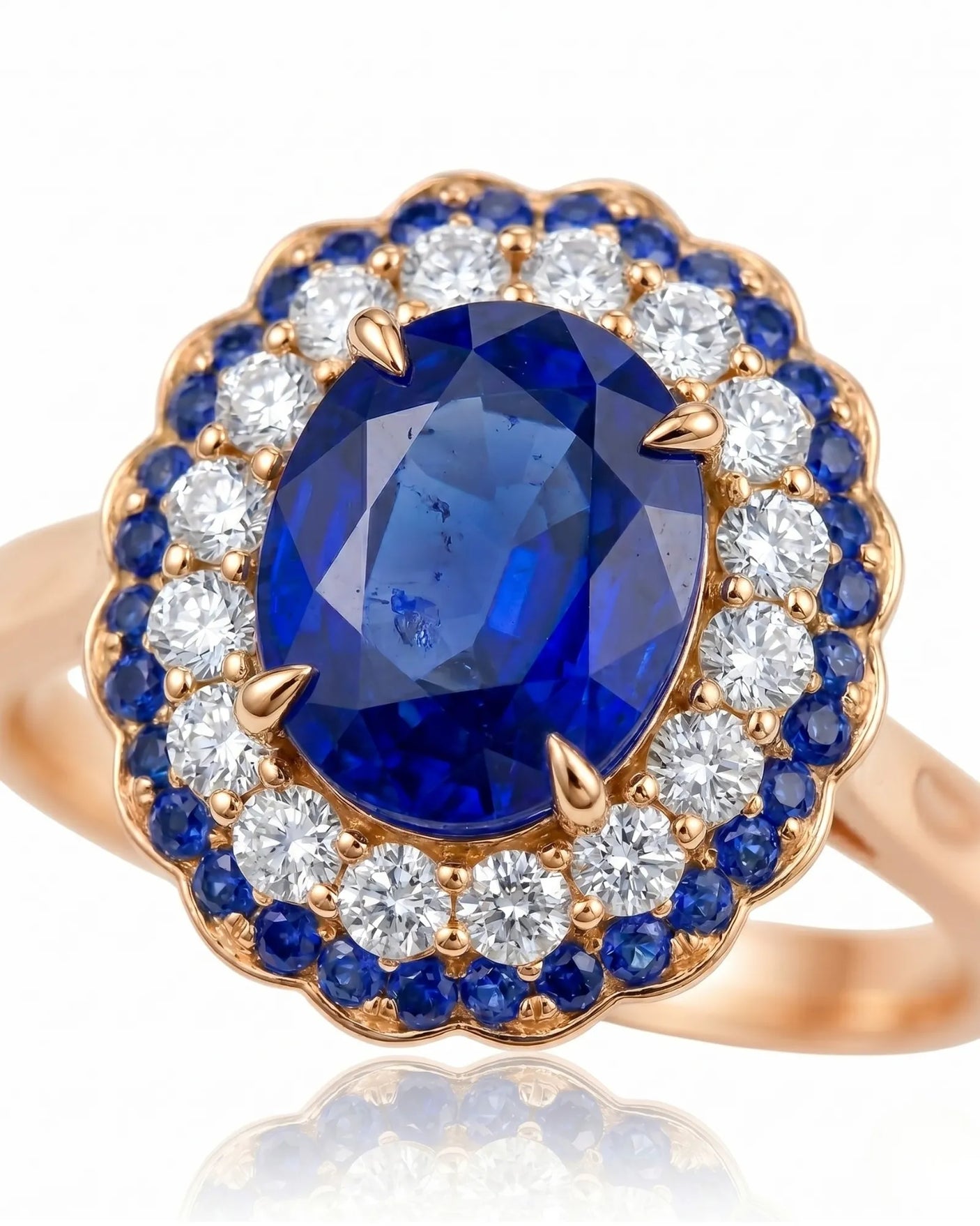 Luxury blue sapphire ring with layered diamond and sapphire halo in 18K rose gold | SARATTI
