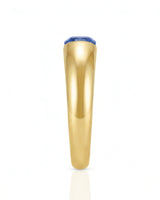 Luxury blue sapphire tension ring with minimalist 18K yellow gold sculptural band | SARATTI
