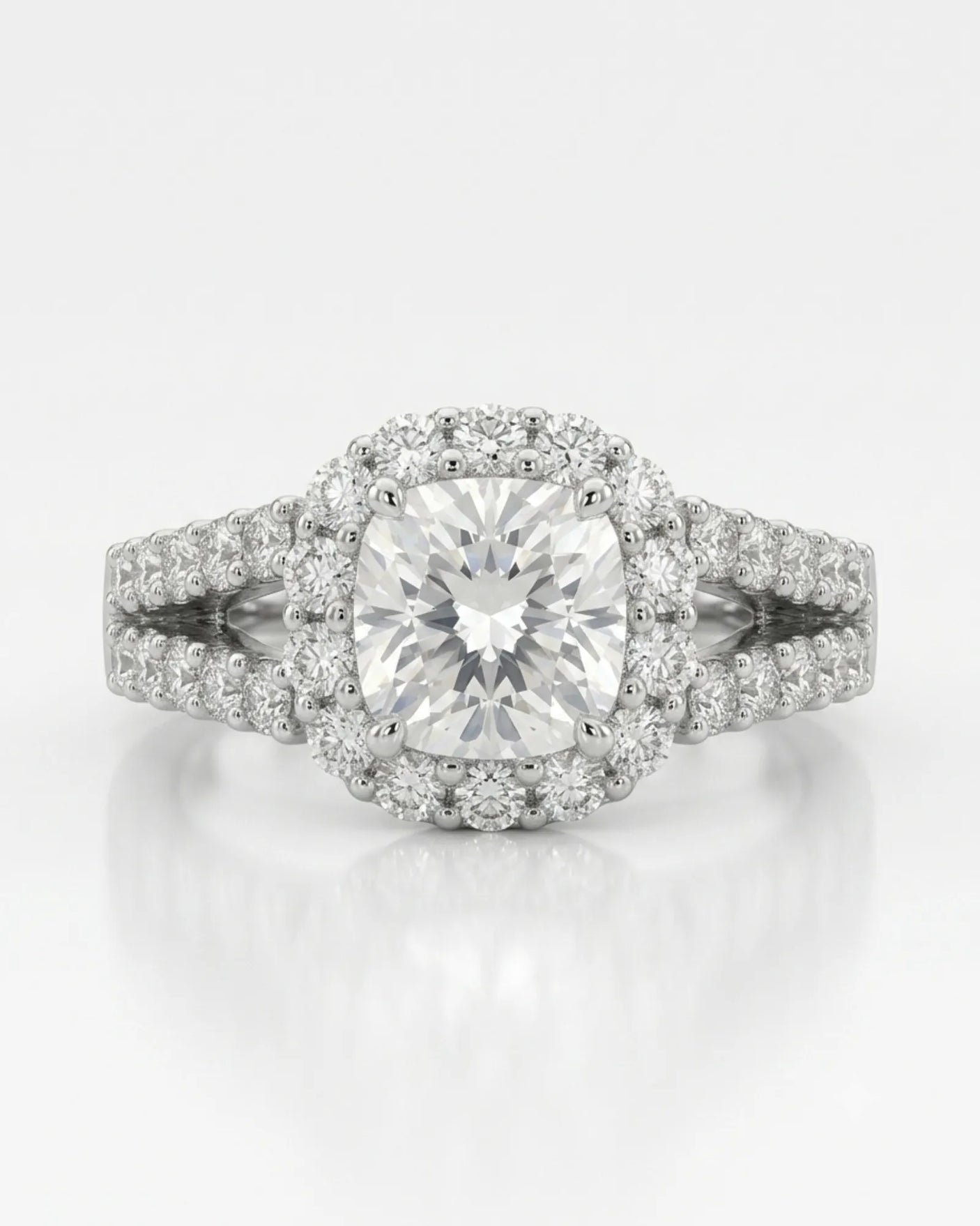 Luxury cushion halo moissanite ring set with sculptural platinum split-shank detailing | SARATTI