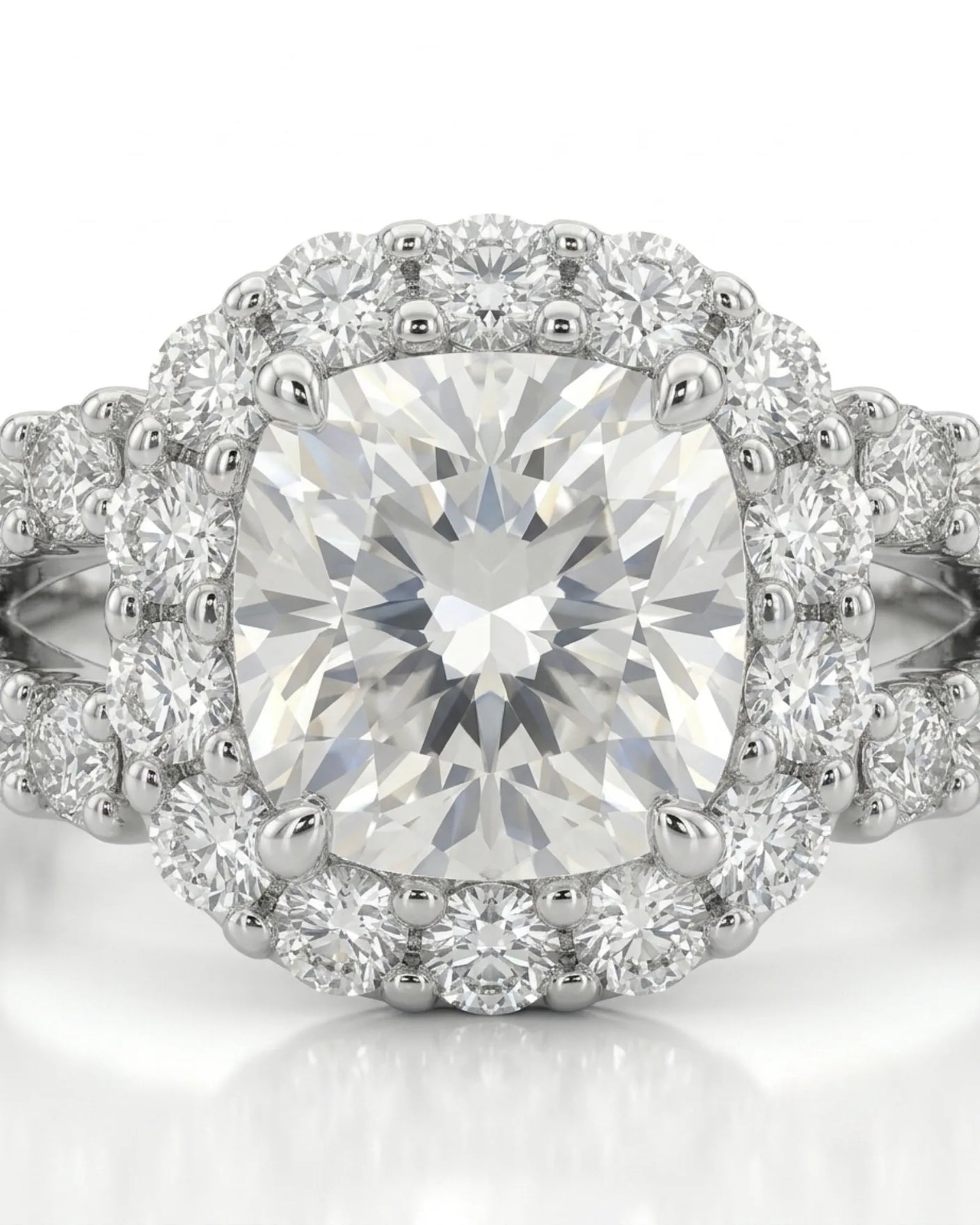 Luxury cushion halo moissanite ring set with sculptural white gold split-shank detailing | SARATTI