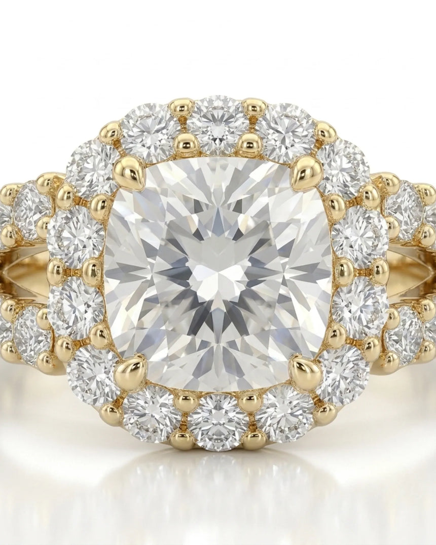 Luxury cushion halo moissanite ring set with sculptural yellow gold split-shank detailing | SARATTI
