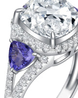 Luxury cushion moissanite ring with tanzanite side stones in platinum | SARATTI