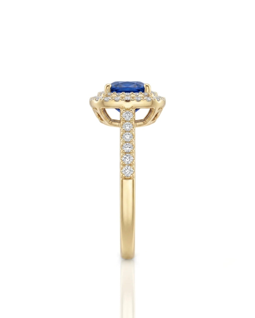 Luxury cushion sapphire diamond ring with warm gold halo setting in 18K yellow gold | SARATTI