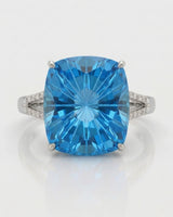 Luxury cushion topaz cocktail ring with architectural diamond shoulders in polished platinum | SARATTI