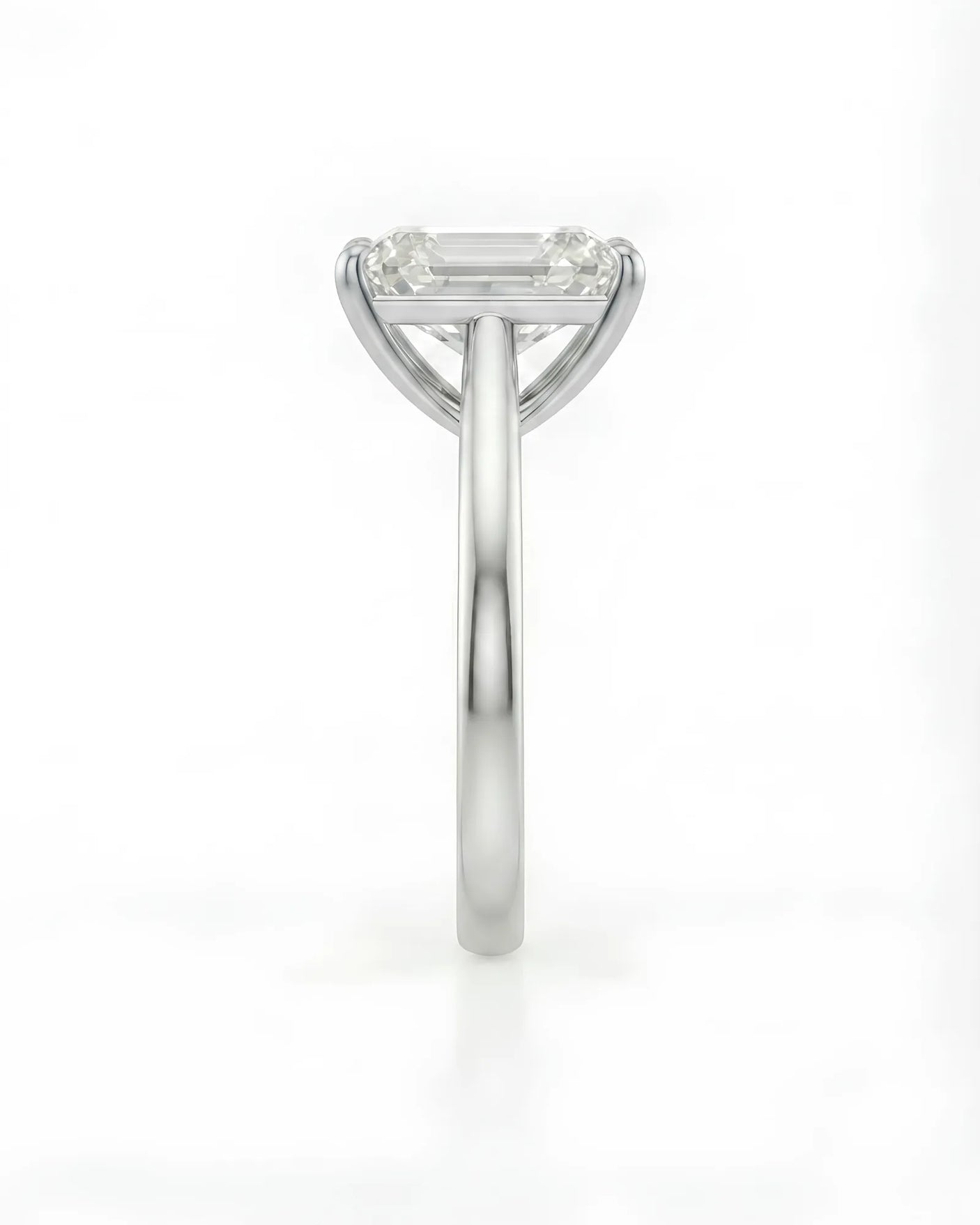 Luxury emerald-cut moissanite solitaire ring with polished platinum band and open gallery | SARATTI