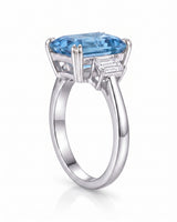 Luxury emerald cut aquamarine ring with refined platinum setting and diamonds | SARATTI
