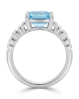Luxury emerald cut aquamarine ring with round diamonds and white gold architecture | SARATTI