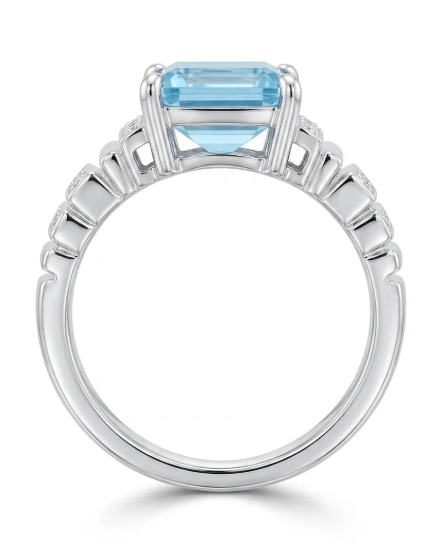 Luxury emerald cut aquamarine ring with round diamonds and white gold architecture | SARATTI
