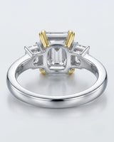 Luxury emerald cut moissanite ring with side stones and refined two tone gold setting - SARATTI