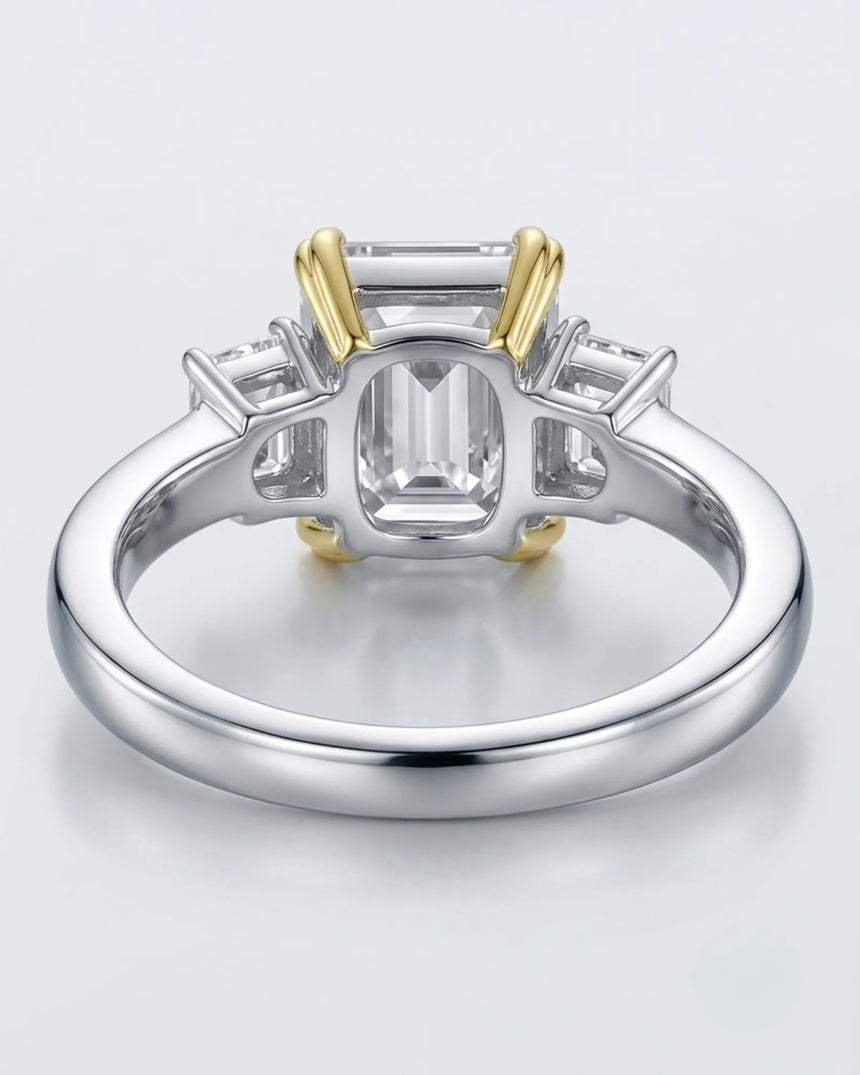 Luxury emerald cut moissanite ring with side stones and refined two tone gold setting - SARATTI