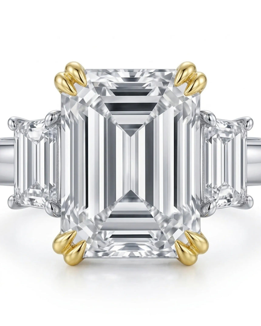 Luxury emerald cut moissanite ring with side stones and refined two tone gold setting | SARATTI