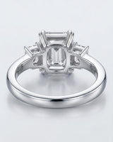 Luxury emerald cut moissanite ring with side stones and refined white gold setting - SARATTI