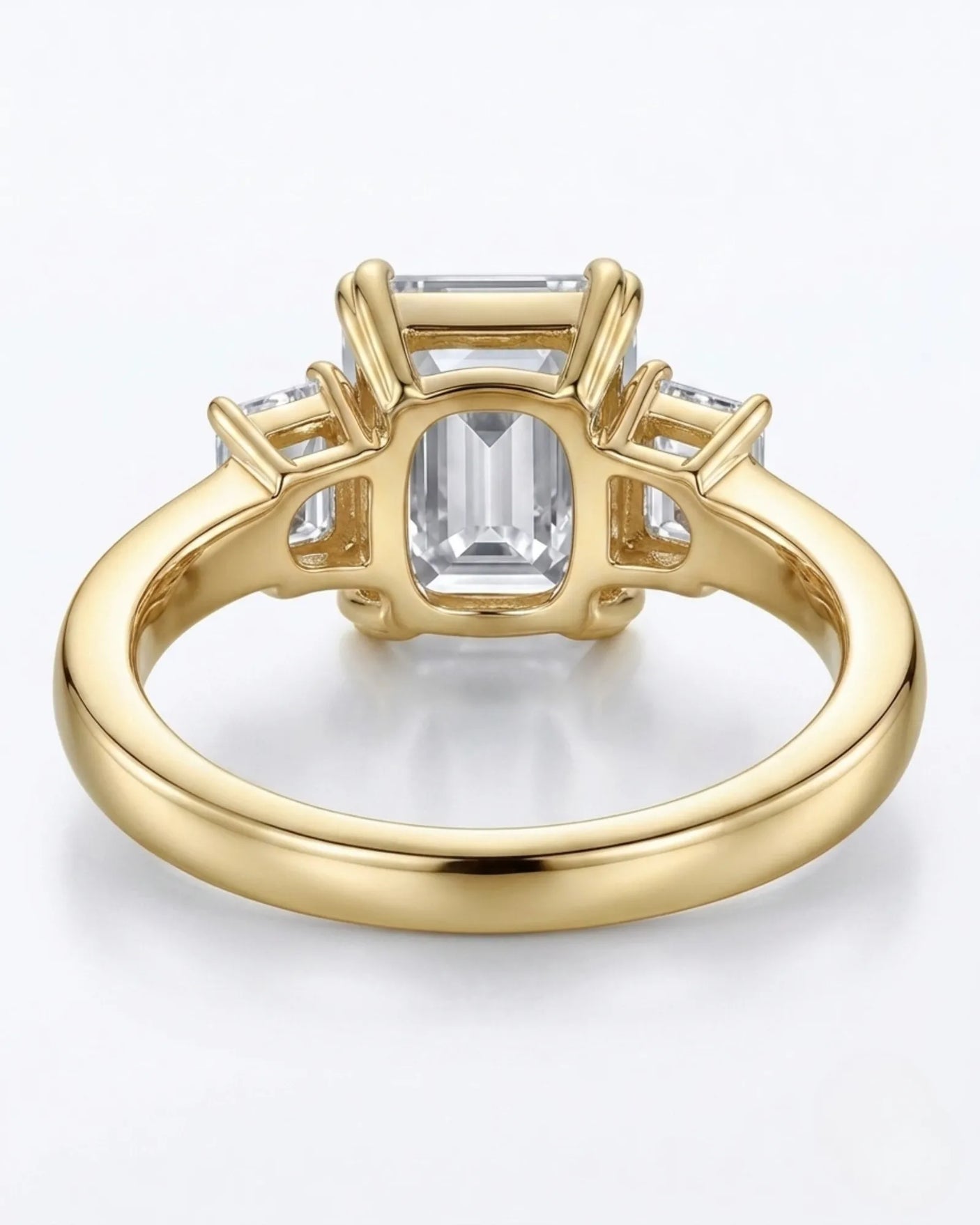 Luxury emerald cut moissanite ring with side stones and rich yellow gold finish - SARATTI