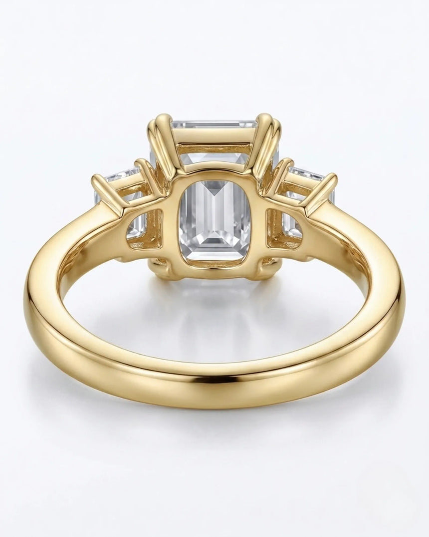 Luxury emerald cut moissanite ring with side stones and rich yellow gold finish - SARATTI