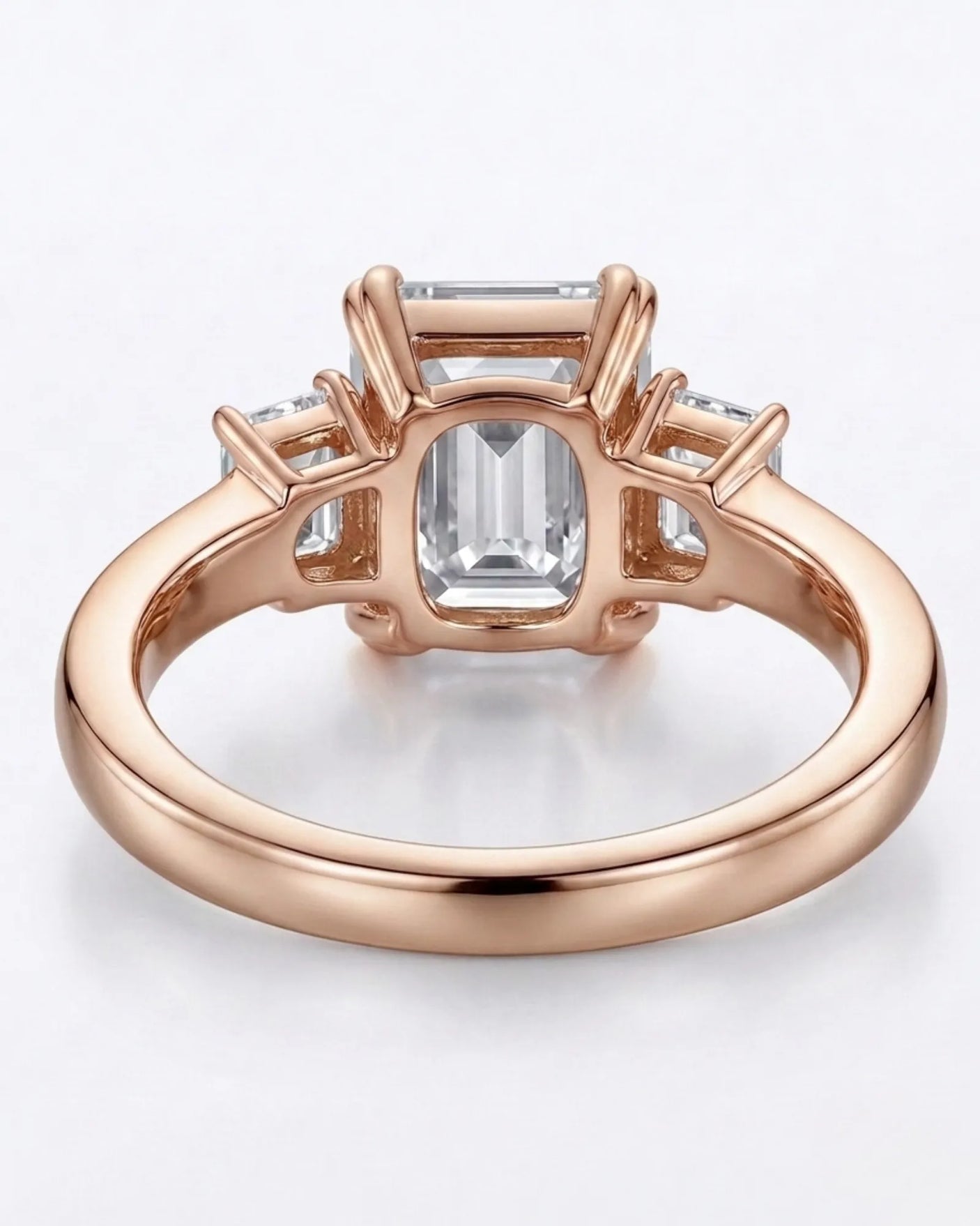 Luxury emerald cut moissanite ring with side stones and romantic rose gold finish - SARATTI