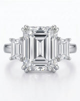 Luxury emerald cut moissanite ring with side stones and timeless platinum finish -- SARATTI