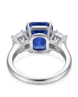 Luxury emerald cut sapphire statement ring with diamond accents in 18K white gold | SARATTI