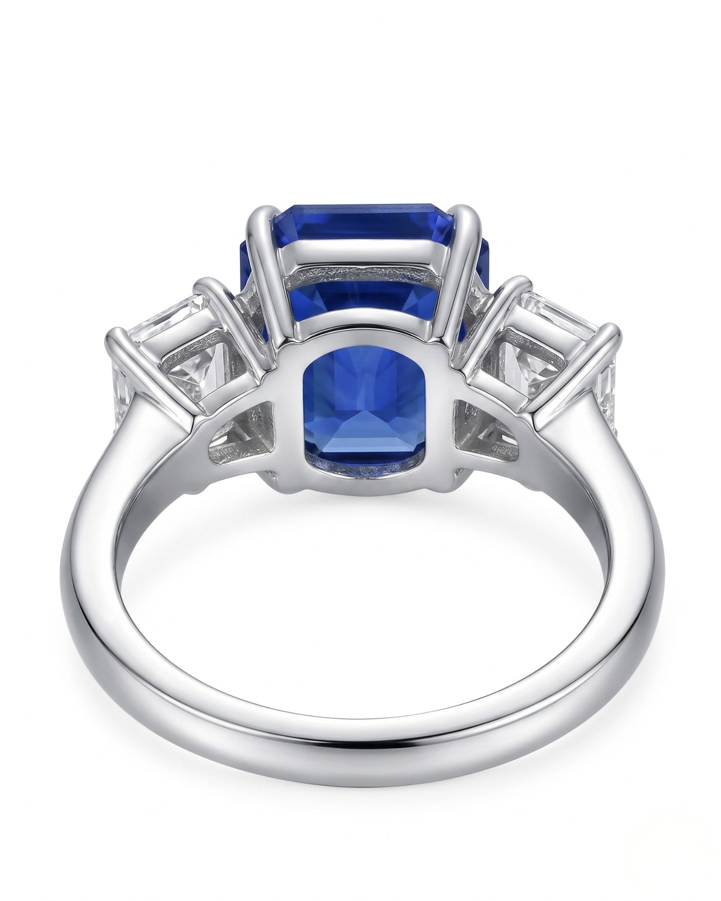 Luxury emerald cut sapphire statement ring with diamond accents in polished platinum | SARATTI