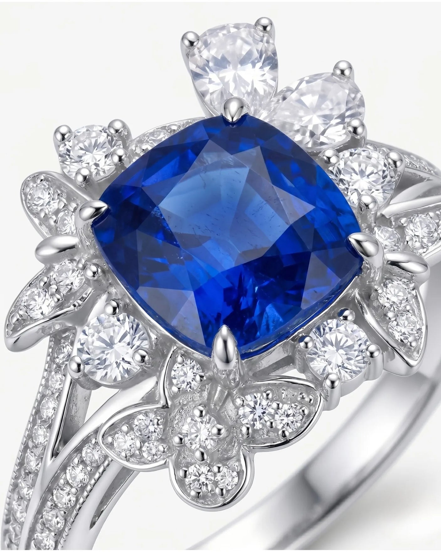 Luxury floral sapphire statement ring with mixed-cut diamonds in 18K white gold | SARATTI