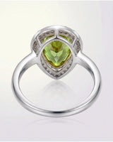 Luxury green tourmaline and diamond halo ring in elegant 18K White Gold | SARATTI