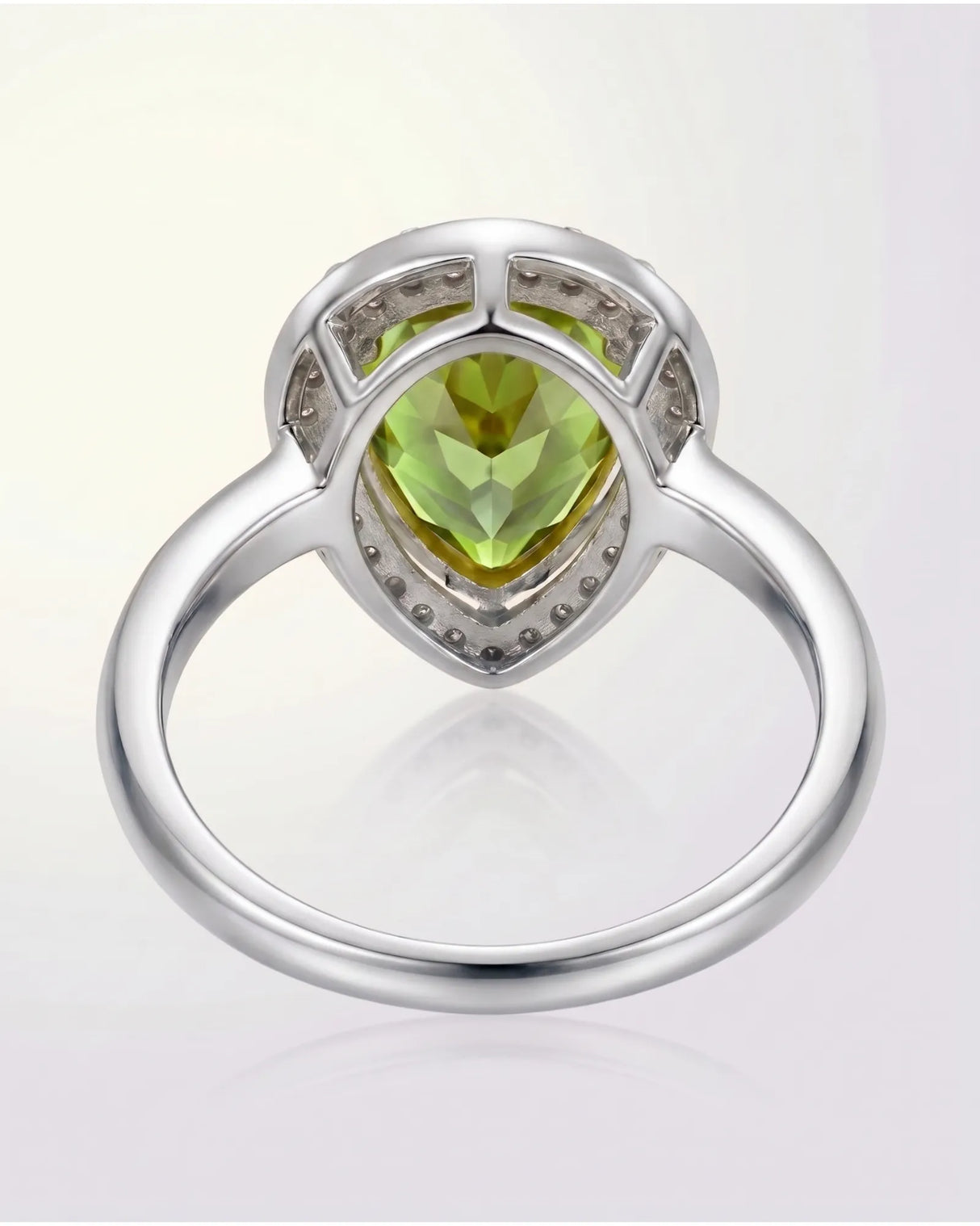 Luxury green tourmaline and diamond halo ring in refined Platinum setting | SARATTI