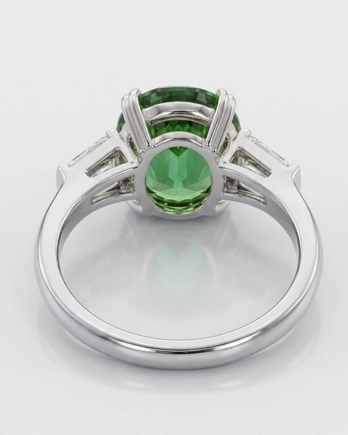 Luxury green tourmaline and diamond ring in platinum with refined three-stone design | SARATTI