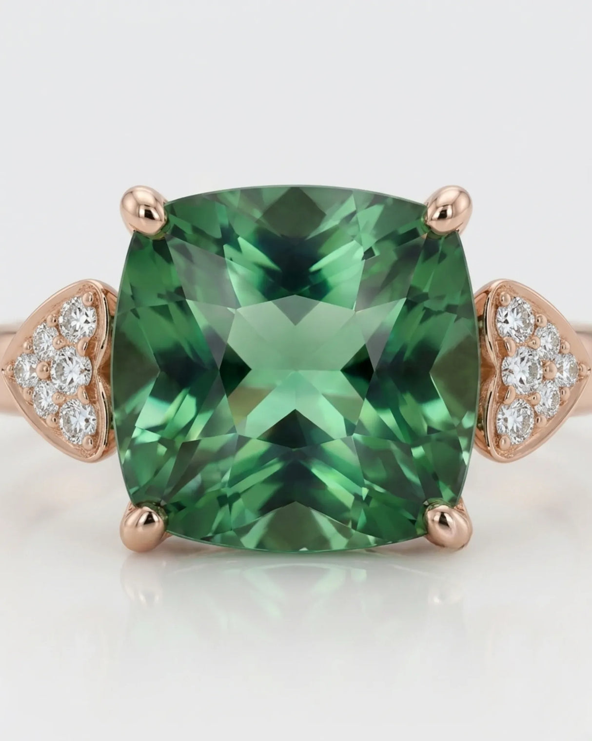 Luxury green tourmaline and diamond ring in rose gold with romantic three-stone design | SARATTI