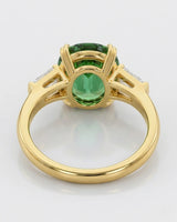 Luxury green tourmaline and diamond ring in yellow gold with refined three-stone design | SARATTI