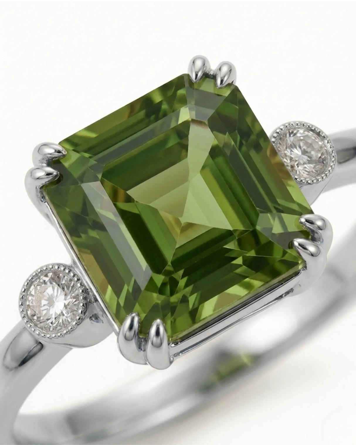 Luxury green tourmaline trilogy ring with natural diamonds in platinum | SARATTI